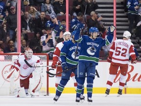 Elias Pettersson celebrates after deflecting Brock Boeser's shot Sunday.