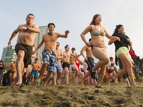Thousands braved the cold waters of English Bay for the 2019 Polar Bear swim in Vancouver on Tuesday.