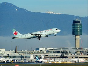 An Air Canada jet takes off against a bank of fog from Vancouver International Airport on Tuesday morning. Late Monday, the federal government updated its advisory for travellers to China ‘due to the risk of arbitrary enforcement of local laws.’