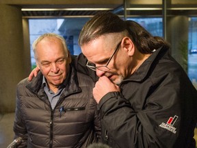 Wade Skiffington, 52, (at right, seen with his father) is released from custody at B.C. Supreme Court in Vancouver, Jan. 23, 2019. Skiffington was found guilty in 2001 of the second-degree murder of Wanda Martin following an undercover police operation in which he confessed to fatally shooting her. In June last year, the federal justice minister ordered an investigation into the case after a preliminary assessment found that there may have been a miscarriage of justice.