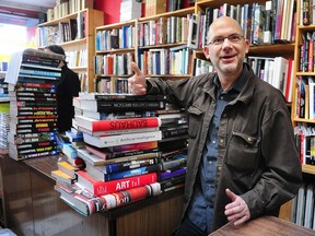 Chris Rayshaw, founder of Pulp Fiction Books, in his flagship Main and Broadway store.