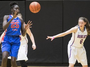 Faith Dut of the Semiahmoo Totems, left, was a tower of power in last year's provincial championship. She's currently on the sidelines recovering from a concussion.