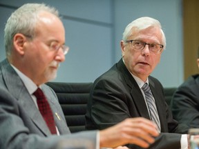 Gary Lenz  (left) and Craig James speak at Fasken Martineau DuMoulin LLP in Vancouver, BC, Nov. 26, 2018.