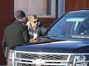 Police from Kingston and then RCMP collect evidence at a home on MacDonnell Street in Kingston after revealing a terror plot was being organized from the home and another home in Kingston on Friday January 25, 2019.