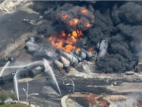 moke rises from railway cars that were carrying crude oil after derailing in downtown Lac-MÃ©gantic, Que., Saturday, July 6, 2013. A day after learning that a science-fiction show on Netflix used actual footage of the Lac-Megantic rail disaster in an episode, the mayor of the Quebec town said she believes images of the tragedy were used in a second Netflix production, "Bird Box."