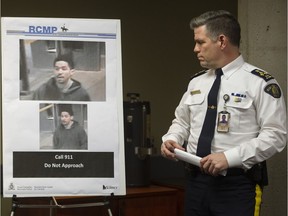 Surrey RCMP Assistant Commissioner Dwayne McDonald looks at photos of the shooting suspect.