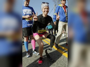 In this April 18, 2016 file photo, Boston Marathon bombing survivor Adrianne Haslet poses at the start line in Hopkinton, Mass., before running in the 120th Boston Marathon. Haslet, who lost her left leg in the 2013 Marathon bombing, is in the hospital after being struck by a car while in a crosswalk in Boston.