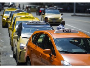Taxi cabs line up near Canada Place.