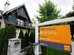 Home sales in Vancouver plunged 32 per cent last year, driving benchmark prices down 6.5 per cent over the past six months, according to Canadian Real Estate Association data released Tuesday.
