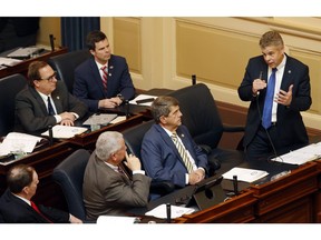 House Speaker Kirk Cox, R-Colonial Heights, right, gestures as he delivers a speech from the floor of the House during session at the Capitol in Richmond, Va., Wednesday, Jan. 30, 2019. Cox spoke against a bill that would expand late term abortions.