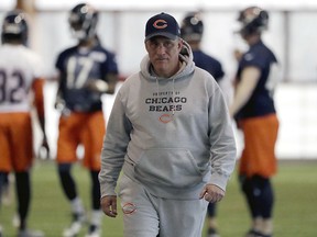 In this April 18, 2018, file photo, Chicago Bears defensive coordinator Vic Fangio watches players during the NFL team's voluntary veteran minicamp in Lake Forest, Ill.(AP Photo/Nam Y. Huh, File)