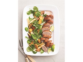 Root vegetables tossed with watercress accompany pork tenderloin coated with brown sugar and cayenne in this one-pan meal.