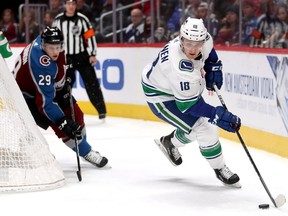 Jake Virtanen of the Vancouver Canucks, right, has been placed on Injured Reserve and will be out of action for at least a week.