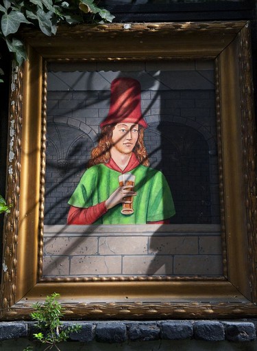 A painting outside an old bar in Antwerp.