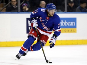 Ryan Spooner of the New York Rangers takes the puck against the Detroit Red Wings on February 25, 2018 at Madison Square Garden in New York City. After a stop with the Edmonton Oilers, Spooner is now a member of the Vancouver Canucks.