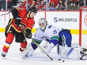 Johnny Gaudreau of the Flames prepares to shoot on Jacob Markstrom of the Vancouver Canucks during NHL action in Calgary.