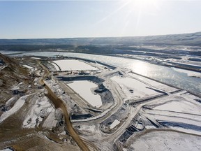 An aerial view of the north bank, with cofferdams and laydown area, looking southeast at the B.C. Hydro Site C dam construction project.