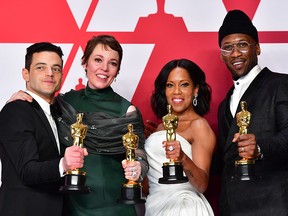 The weeks and months leading up to Hollywood's biggest night were not easy. From left to right, Emilia Clarke, Spike Lee, Constance Wu and Regina King pose on the red carpet as they arrive at the Oscars at the Dolby Theatre in Los Angeles on Sunday, Feb. 24, 2019.