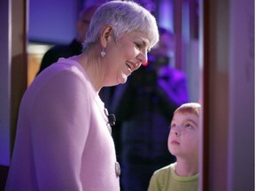 B.C. Finance Minister Carole james with her eight-year-old grandson Charlie James at the Royal B.C. Museum in Victoria on Monday, the day before the finance minister delivered the provincial budget.