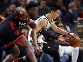 Atlanta Hawks guard Jeremy Lin (7) goes to the basket as Toronto Raptors forward OG Anunoby (3) defends during the first half of an NBA basketball Thursday, Feb. 7, 2019, in Atlanta.