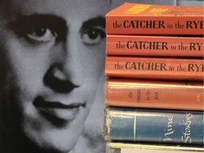 FILE - This Thursday, Jan. 28, 2010, file photo shows copies of J.D. Salinger's classic novel "The Catcher in the Rye" as well as his volume of short stories called "Nine Stories" at the Orange Public Library in Orange Village, Ohio. In comments which appeared Friday, Feb. 1, 2019 in The Guardian, Matt Salinger, son of the famous author, confirmed longstanding reports that his father had continued to write long after he stopped publishing books and that he and Salinger's widow are "going as fast as we freaking can" to prepare the material for release.