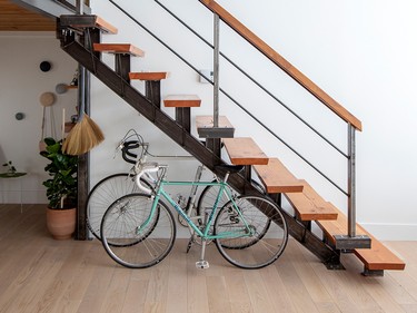 The staircase to the loft bedroom also provides handy storage space for bikes.