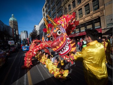 A dragon dance team prepares for the Chinese New Year Parade in Vancouver on Sunday, Feb. 10, 2019. More than 3,000 people participated in the parade according to organizers and more than 100,000 spectators were expected to line the parade route.
