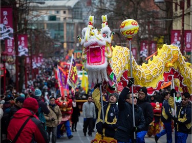 A dragon dance team performs during the Chinese New Year Parade in Vancouver on Sunday, Feb. 10, 2019.