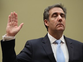 Michael Cohen, former personal lawyer to U.S. President Donald Trump, is sworn in during a House Oversight Committee hearing in Washington, D.C., U.S., on Wednesday, Feb. 27, 2019.
