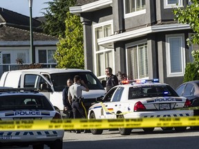 Police at Alpine Lane in Coquitlam, on July 16, 2015.