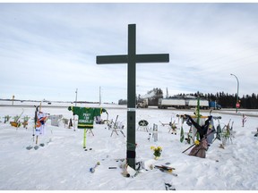 A memorial for the 2018 crash where 16 people died and 13 injured when a truck collided with the Humboldt Broncos hockey team bus, is shown at the crash site on Wednesday, January 30, 2019 in Tisdale, Sask. Saskatchewan's coroner's service has released its report into the Humboldt Broncos bus crash and it calls for tougher enforcement of trucking rules and mandatory seatbelts on highway buses.THE CANADIAN PRESS/Ryan Remiorz