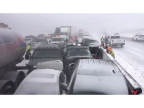 Vehicles are piled up after a crash on Highway 400 south of Barrie, Ont. on Monday, Feb.25, 2019 in a photo from the Twitter user @OPP_HSD. Authorities say a major highway in southern Ontario has been closed in both directions to deal with a collision involving dozens of vehicles. T