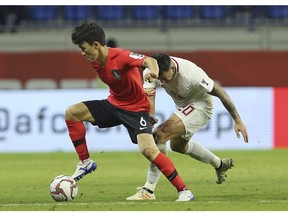 South Korea's midfielder Hwang In-Beom, left, controls the ball during the AFC Asian Cup group C soccer match between South Korea and Philippines at Al Maktoum Stadium in Dubai, United Arab Emirates on January 7, 2019. A new-look Vancouver Whitecaps are set to kick off the next phase of their pre-season. The team, including newly signed burgeoning South Korean soccer star Hwang In-beom, set off for Hawaii on Thursday, where they'll continue training camp and play a series of friendly matches.