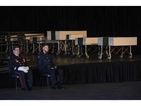 Caskets of the seven Barho siblings rest on a stage behind Halifax Fire and Police honour guard during the funeral for the Syrian refugees in Halifax on Saturday, February 23, 2019. The siblings, who died in a house fire earlier in the week, are survived by their parents.