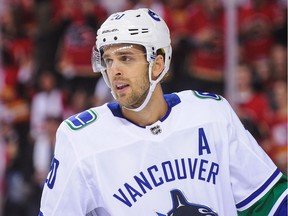 Brandon Sutter #20 of the Vancouver Canucks in action against the Calgary Flames during an NHL game at Scotiabank Saddledome on October 6, 2018 in Calgary, Alberta, Canada.