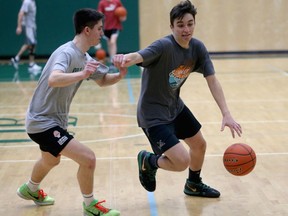 Oak Bay High's Diego Maffia, right, with teammate Jaime Palamos. Maffia scored what is thought to be the most points in a basketball game by a B.C. high school player in a game on Saturday, Feb. 9, 2019.