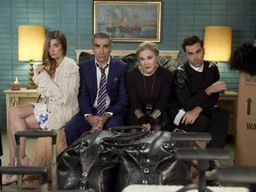 Annie Murphy as Alexis Rose, left to right, Eugene Levy as Johnny Rose, Catherine O'Hara as Moira Rose and Dan Levy as David Rose in CBC's comedy "Schitt's Creek" pose in an undated handout photo.