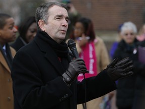 In this Jan. 14, 2019, file photo, Virginia Gov. Ralph Northam speaks to a crowd during a Women's Rights rally at the Capitol in Richmond, Va. (AP Photo/Steve Helber, File)