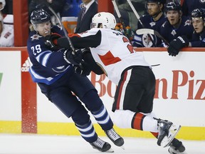 Winnipeg Jets' Patrik Laine can't get past Ottawa Senators' Dylan DeMelo during second period NHL action in Winnipeg on Saturday, February 16, 2019.