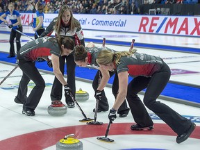 Ontario skip Rachel Homan directs lead Lisa Weagle, second Joanne Courtney and third Emma Miskew, left to right, as her last shot in an extra end came up short to allow Alberta to win the Scotties Tournament of Hearts 8-6 at Centre 200 in Sydney, N.S. on Sunday, Feb. 24, 2019. (THE CANADIAN PRESS/Andrew Vaughan)