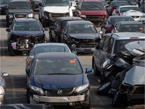 Damaged vehicles are seen at the Insurance Corporation of British Columbia's Lower Mainland Salvage Yard, in New Westminster, B.C., on Friday August 11, 2017.