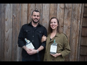 Jason and Alayne MacIsaac, owners of Sheringham Distillery with bottles of the Seaside Gin which captured World's Best Contemporary Gin at this year's World Gin Awards