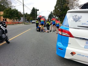 First responders tend to Cst. Jeff Palmer after he suffered a cardiac arrest during a fundraising bike ride in 2015.