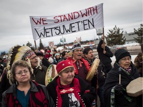 Hereditary Chief Ronnie West, centre, from the Lake Babine First Nation, sings and beats a drum during a solidarity march after Indigenous nations and supporters gathered for a meeting to show support for the Wet'suwet'en Nation, in Smithers, B.C., on Jan. 16, 2019.