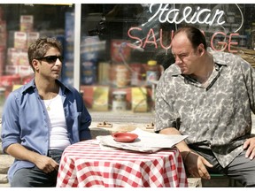 This undated image released by HBO shows Michael Imperioli, left, and James Gandolfini in a scene from "The Sopranos." The TV show is celebrating the 20th anniversary of its premiere. The six-season show would win 21 Emmys and become the first cable series ever to win the Emmy for outstanding drama series. (HBO via AP)