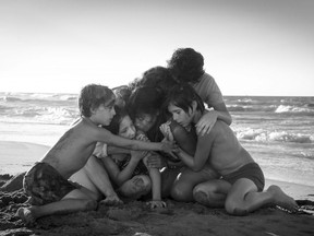 This image released by Netflix shows Yalitza Aparicio, centre, in a scene from the film "Roma," by filmmaker Alfonso Cuaron.