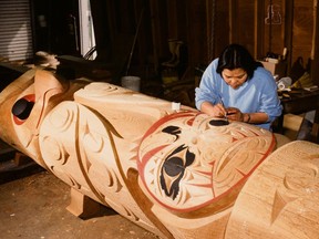 Susan Point, acclaimed Musqueam artist carves a major work.