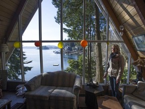 Nancy Strain of Coquitlam with the family cabin her father built in 1963 on the water in Belcarra, BC Wednesday, February 6, 2019. Strain's family will have to pay an extra $5,000 per year in speculation taxes, although the cabin is uninsulated and is not on city sewer, thus making it unrentable for the times of year when it is not being used by the family.