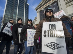 More than 100 striking Vancouver Art Galley employees and supporters rally at the gallery in downtown Vancouver, BC Saturday, February 9, 2019.