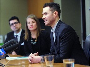 Port Coquitlam Mayor Brad West with Vancouver Coun. Christine Boyle and Simon Tremblay, former assistant-chief deputy of the Charbonneau Commission at a news conference in February, ahead of a council vote on Boyle's motion calling for a public inquiry into organized crime, money laundering and opioid and affordability crises.